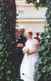 Bride between the trees.JPG (29345 bytes)