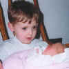 Newborn_Cassiy_with_Tyler.jpg (13596 bytes)